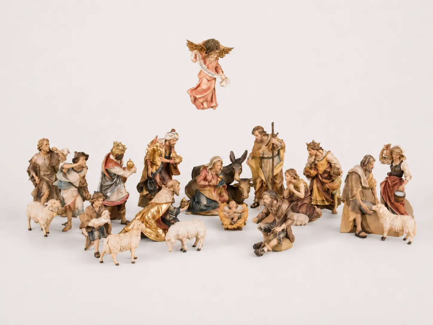 Baroque-inspired hand-painted wooden nativity figures from Val Gardena in South Tyrol used for the Alpina collection